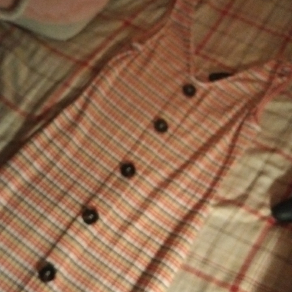 Long skin tight dress with seven buttons going down the size is medium and it's